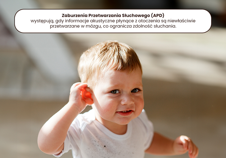 baby boy listens to put a hand to his ear.